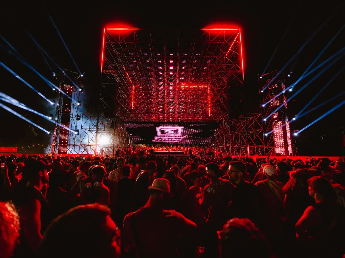 All four surfaces running from one engine at night: volumetric matrix, main screen and tower screens, Isle of Summer Vienna 2026